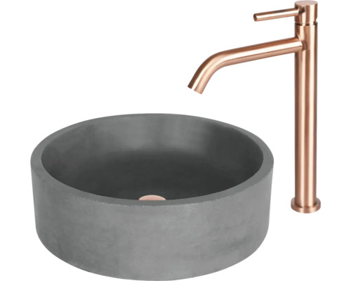 Grijze betonnen opzetwastafel met kraan