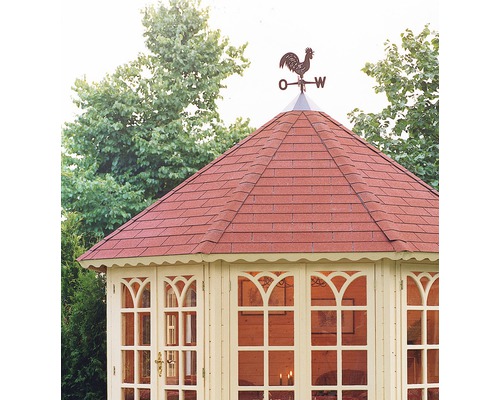 Detail van een tuinhuis met een windwijzer op het dak