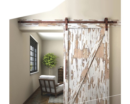 Interieur met schuifdeur in schuurstijl en zithoek