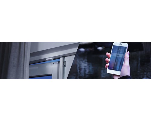Slim deur- en raamcontact naast een smartphone