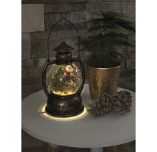 Decoratieve sneeuwbollantaarn met kerstmotief en verlichting.