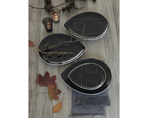 Decoratieve opstelling met zwarte borden met geometrische patronen