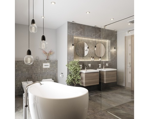 Moderne badkamer met vrijstaand bad, wastafels en grijze tegels