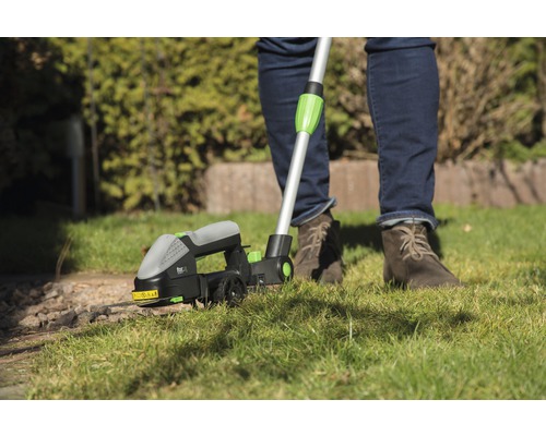 Grasrandtrimmer in gebruik voor gazononderhoud