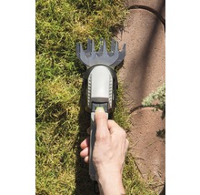 Hand bedient gazontrimmer op gazon