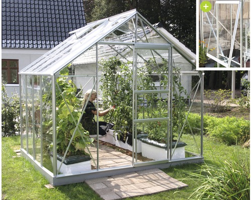 VITAVIA Tuinkas Meridian 1 6700 veiligheidsglas 3 mm alu, 257x258x231,8 cm Kas met planten en een persoon die erin werkt