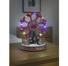 Verlichte, bewegende reuzenrad als kerstversiering met figuren.