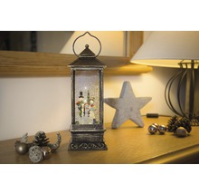 Decoratieve lantaarn met sneeuwpopfiguren en glittereffect voor de kerstperiode
