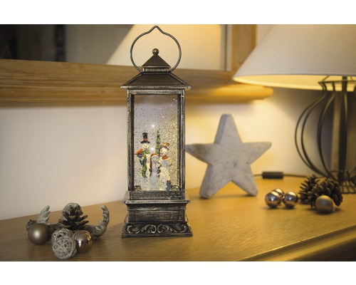 Decoratieve lantaarn met sneeuwpopfiguren en glittereffect voor de kerstperiode