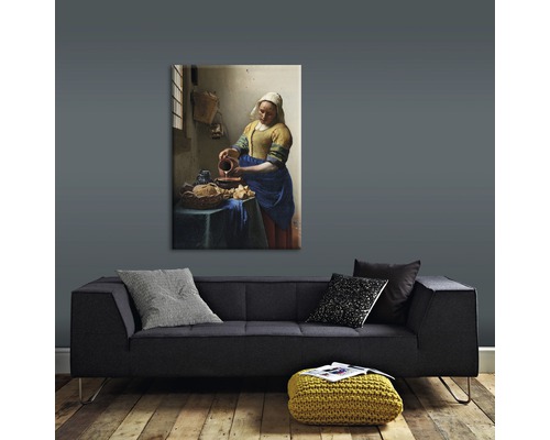 Schilderij van Johannes Vermeer Melkmeisje boven een bank
