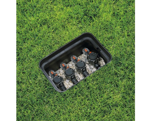 Irrigatieventielen in een box in het gazon