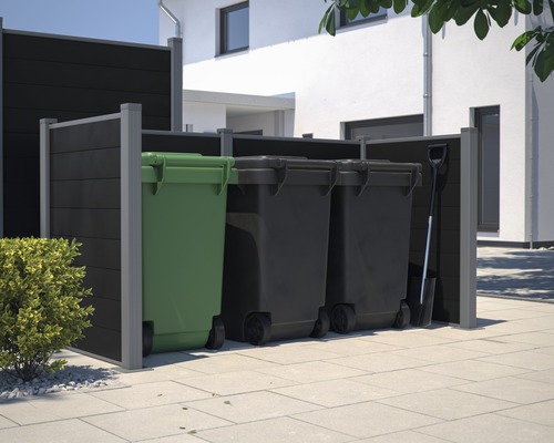 Afvalcontainerberging met drie afvalcontainers en een spade