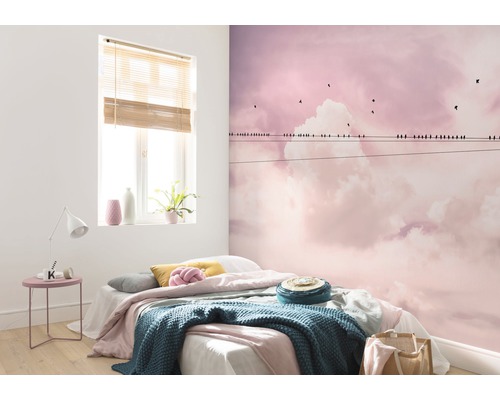Slaapkamer met fotobehang met wolken- en vogelmotief