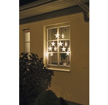 Kerstdecoratie met sterrenlichtjes in het raam