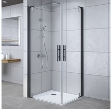 Hoekdouche met douchebak en zwart frame in badkamer.