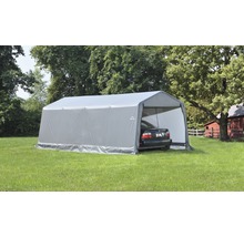 Grijze tentcarport met auto op een gazon