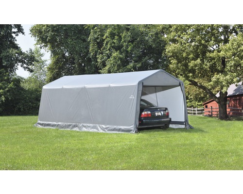 Grijze tentcarport met auto op een gazon