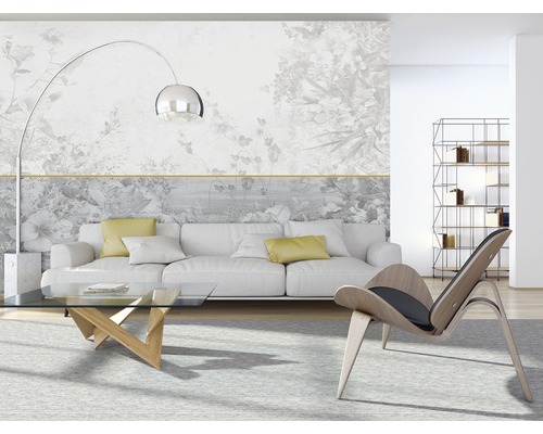 Woonkamer met bank, fauteuil, tafel en fotobehang