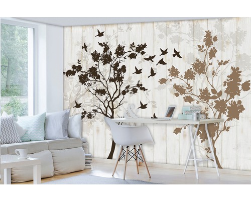 Woonkamer met fotobehang met boom en vogelsilhouet
