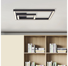 Vierkante plafondlamp met ledverlichting boven een boekenkast