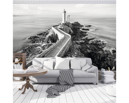 Woonkamer met fotobehang van een vuurtoren met stenen brug