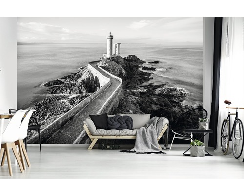 Zwart-wit fotobehang met vuurtorenmotief in een woonkamer