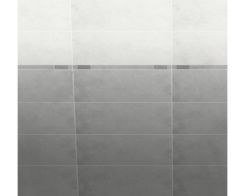 Wandtegels in twee grijstinten met decoratieve strook