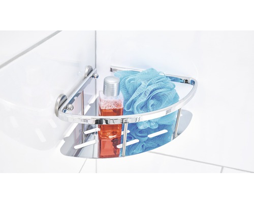 Metalen hoekplank met douchegel en badspons