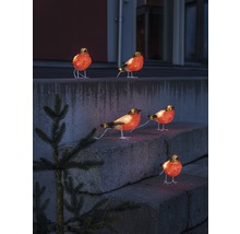 Decoratieve verlichte vogel figuren op een stenen trap.