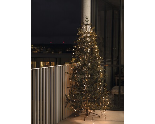 KONSTSMIDE Kerstverlichting LED boommantel met ring 400 lampjes extra warmwit 4 m Kerstboom met lichtslinger op een balkon.