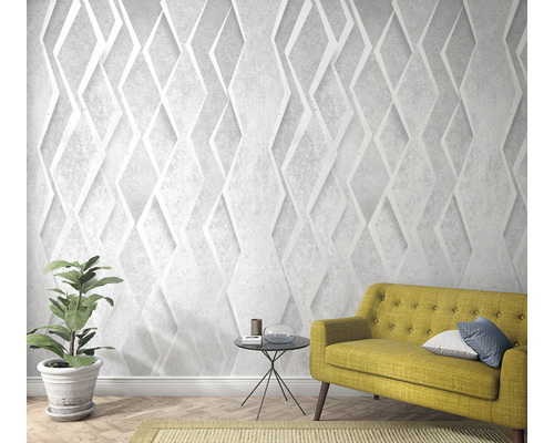 Woonkamer met driedimensionaal diamantbehang, bank en kamerplant