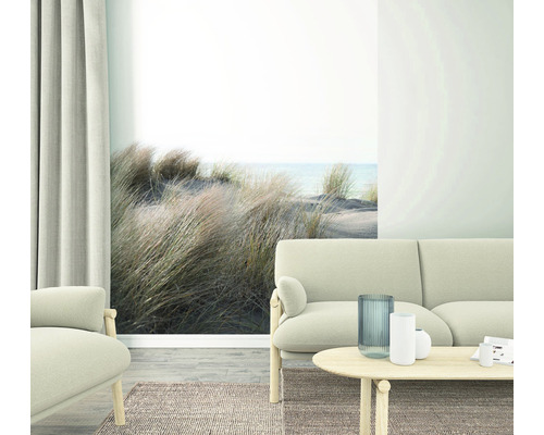 Woonkamer met bank en strandbehang