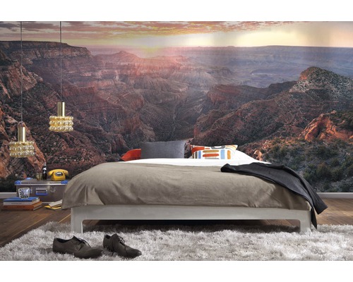 Slaapkamer met fotobehang van een canyon, bed en vloerkleed