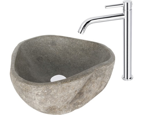 Op een afbeelding zijn een natuurstenen wastafel en een kraan te zien.