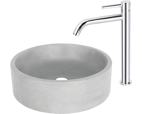 Ronde wastafel van beton met verchroomde kraan