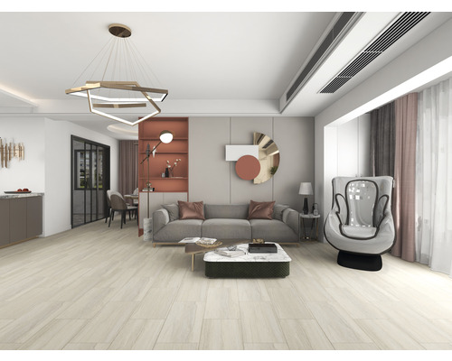 Lichte woonkamer met bank, fauteuil, salontafel en hanglamp