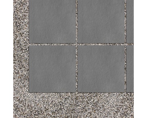 Grijze terrastegels op een grindbed