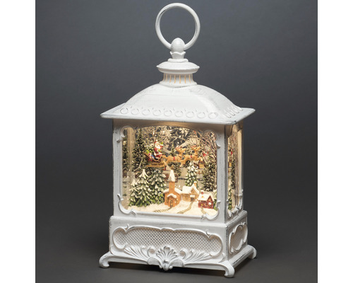 Decoratieve kerstlantaren met kerstman in slee en winterlandschap
