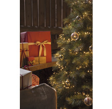 Kerstboom met lichtjes, cadeaus en cadeauzak