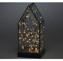 Decoratieve lamp in de vorm van een huis met lichtjes