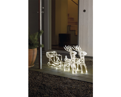 Verlichte slee met rendieren als kerstdecoratie voor een voordeur.