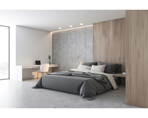 Lichte slaapkamer met tweepersoonsbed, bureau en betonnen muur