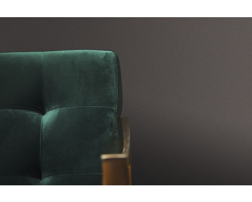 Detailweergave van een groene, gecapitonneerde fauteuil