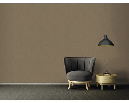 Kamerweergave met fauteuil, bijzettafel en hanglamp