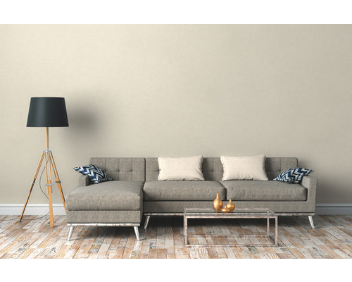 Woonkamer met hoekbank, staande lamp en salontafel
