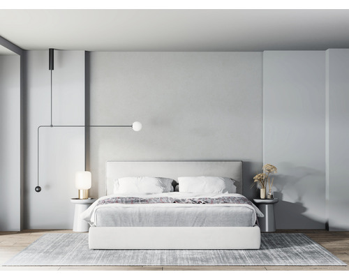 Slaapkamer met bed, nachtkastjes en verlichting