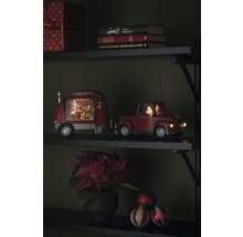 Decoratieve scène met kersttruck en caravan op een plank, feestelijke sfeer