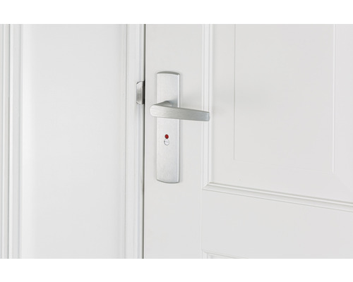 Deurbeslag met slotindicator op een witte deur