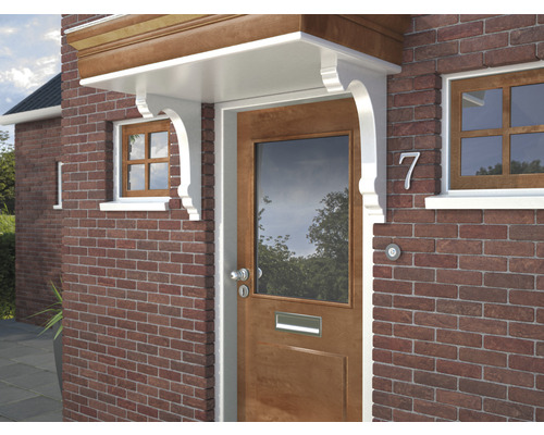 Entree van een huis met luifel en bakstenen gevel.