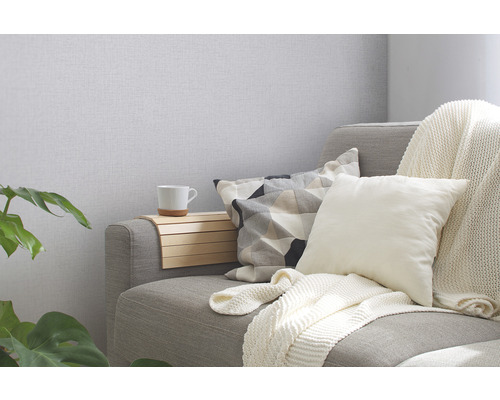 Gezellige zithoek met kussens, deken en drankhouder